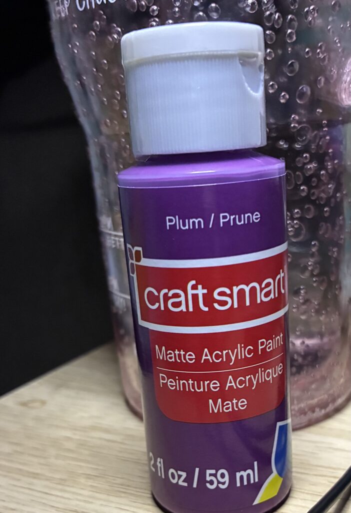 plum acrylic paint in small bottle